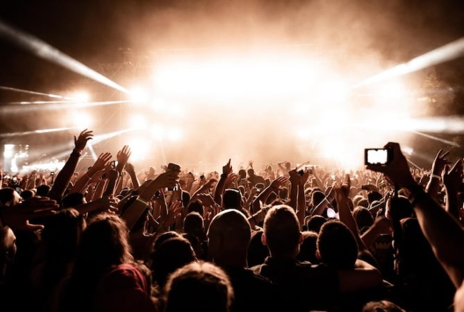 rear-view-crowd-excited-people-having-fun-front-stage-music-concert-night-copy-space-copy-space_637285-603